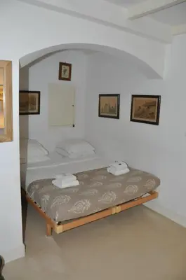 a bedroom with a bed with two towels on it at Perfect APT - Heart of Amsterdam in Amsterdam