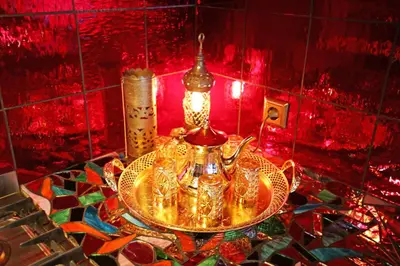 a gold tea set on a table in a room at Paradijs Eiland in Hillegom