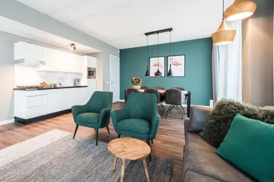 a living room with a couch and a table at YAYS Amsterdam North by Numa in Amsterdam