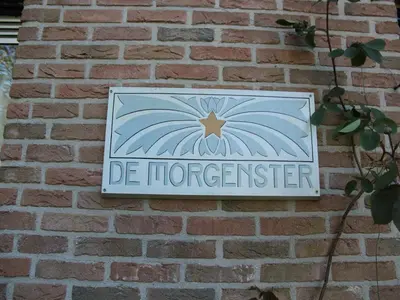 a sign on a brick wall with the words de florencector at Holiday Home in Bergen aan Zee with Terrace in Bergen aan Zee