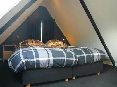 a bed in a tent in a room at Apartment in Heiloo near North Sea Beach in Heiloo