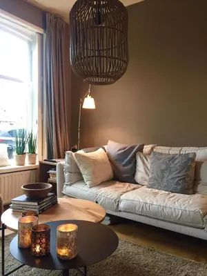 a living room with a couch and a table at Charming countryhouse near Amsterdam in Abcoude