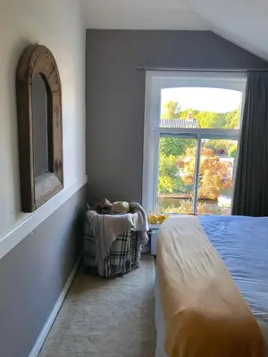 a bedroom with a bed and a window at Charming countryhouse near Amsterdam in Abcoude