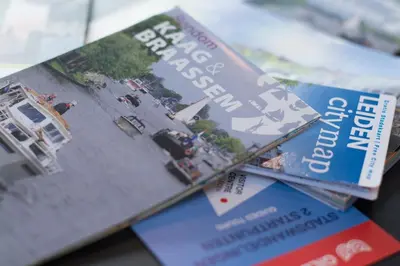 two magazines sitting on top of a table at Ghoyhuys in Leiderdorp