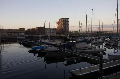 a group of boats docked in a marina at Marbles Inn in Amsterdam