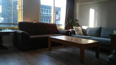 a living room with two couches and a coffee table at Marbles Inn in Amsterdam