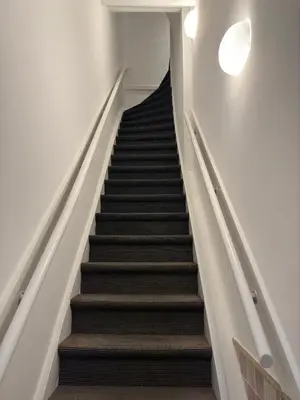 a staircase leading up to the top of a building at Nine Streets Inn in Amsterdam