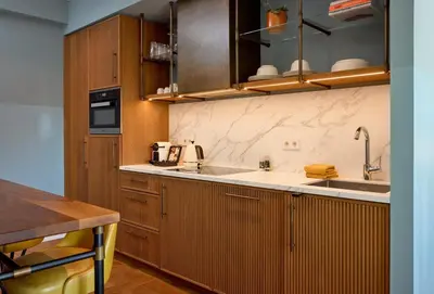 a kitchen with wooden cabinets and a sink at The July - Twenty Eight in Amsterdam