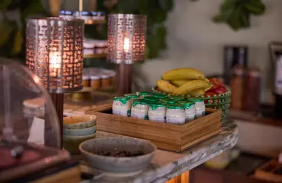 a table with bananas and other food items on it at The July - Twenty Eight in Amsterdam