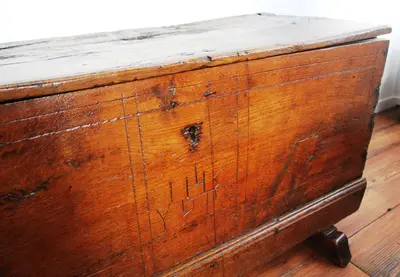 an old wooden chest on a wooden floor at Former Rembrandt workshop two bedroom B&B in Amsterdam