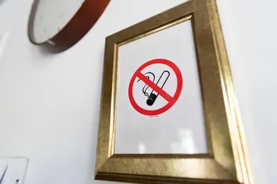 a no smoking sign in a frame on a wall at Former Rembrandt workshop two bedroom B&B in Amsterdam