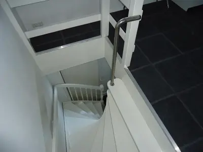 a white staircase with a metal railing in a room at B&B Sloterpark in Amsterdam