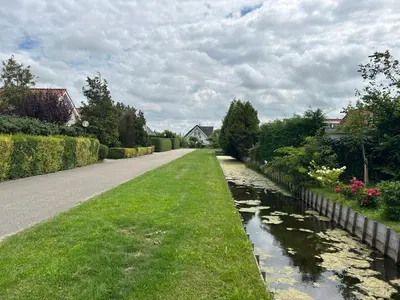 a road leading down a street with a river at Holiday Home Alk 6 by Interhome in Noordwijk