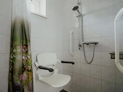 a bathroom with a toilet and a shower at Holiday Home Kraaijennest by Interhome in Uitgeest