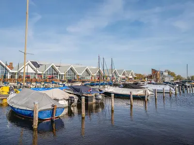a group of boats docked at a marina at Holiday Home Dorregeest-1 by Interhome in Uitgeest