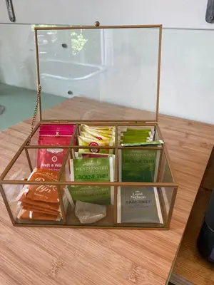 a glass container filled with different types of food at Tiny House De Oude Berg in Bergen