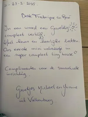 a piece of paper with handwriting on it at Tiny House De Oude Berg in Bergen