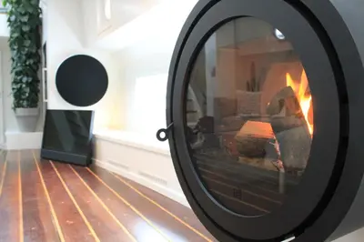 a fire place in a living room with a fireplace at Luxurious 110m² 3br Houseboat in Amsterdam Centre! in Amsterdam