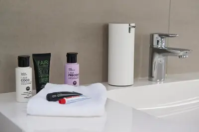 a bathroom counter with a toothbrush and other bathroom items at Luxurious 110m² 3br Houseboat in Amsterdam Centre! in Amsterdam