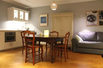 a kitchen and dining room with a table and chairs at De Verrassing in Utrecht