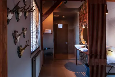 a bathroom with a sink and a mirror at Boutiquehotel Staats in Haarlem