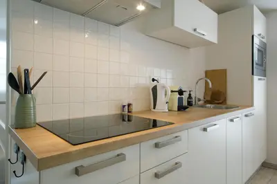 a kitchen with a sink and a counter top at 