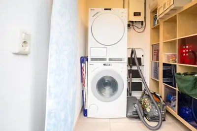 a washer and dryer in a laundry room at Ferienhaus Sonnenschein in Sint Maarten