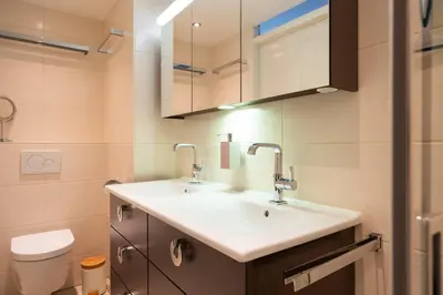 a bathroom with a sink and a toilet at Ferienhaus Sonnenschein in Sint Maarten