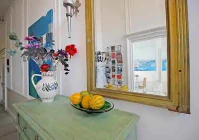 a table with a mirror and a plate of fruit at Cozy Jordaan canalhouse near Anne Frank House in Amsterdam
