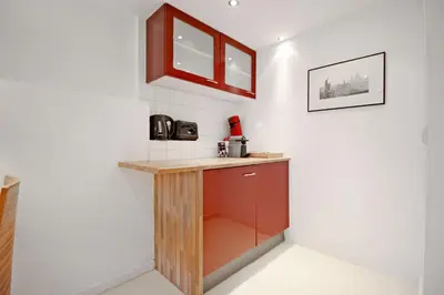 a kitchen with a counter and a sink at Romantic Jordaan Canalsuite near Anne Frank House in Amsterdam