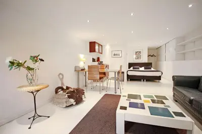 a living room with a couch and a table at Romantic Jordaan Canalsuite near Anne Frank House in Amsterdam
