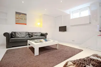 a living room with a couch and a coffee table at Romantic Jordaan Canalsuite near Anne Frank House in Amsterdam