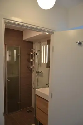 a bathroom with a shower and a sink at Beach Apartment Ikusasa in Zandvoort