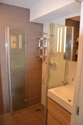 a bathroom with a shower and a sink at Beach Apartment Ikusasa in Zandvoort
