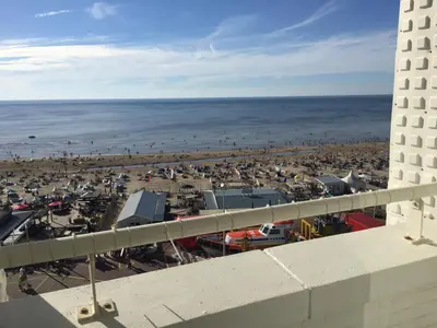 a view of the beach from the balcony of a building at Beach Apartment Ikusasa in Zandvoort