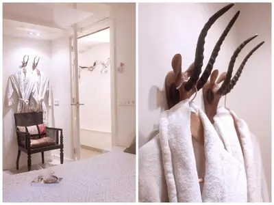 a room with a bed with a towel hanging on a wall at Cozy Canal Studio in Amsterdam