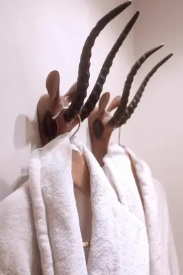 a person holding a wooden reindeer with long antlers at Cozy Canal Studio in Amsterdam