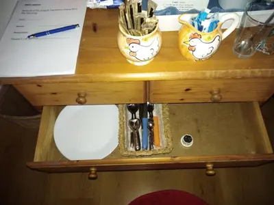 a wooden table with three cups on top of it at Hetem's Room in Amsterdam