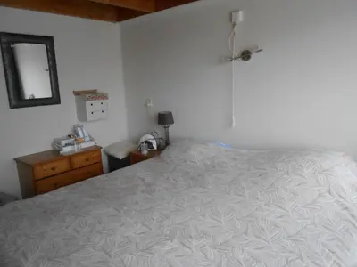 a bedroom with a bed and a dresser and a mirror at Hetem's Room in Amsterdam