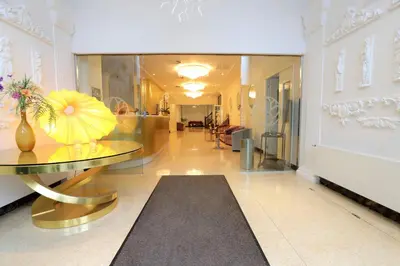 a hallway with a glass table in a building at Chasse Boutique Hotel in Amsterdam