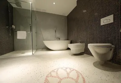 a bathroom with a tub and a toilet and a shower at Chasse Boutique Hotel in Amsterdam