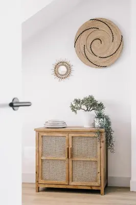 a room with a table with a rattanarmaarmaarmaarmaarmaarmaarma at Boulevard 5 in Zandvoort