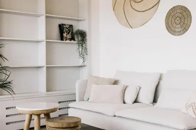 a living room with a couch and a table at Boulevard 5 in Zandvoort
