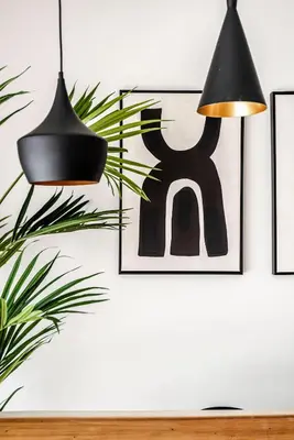 a room with two black lamps and a plant at Sack-Time fashion boutique hotel 1 & 2 in Zandvoort