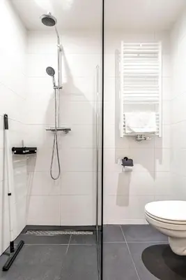 a bathroom with a shower and a toilet at Sack-Time fashion boutique hotel 1 & 2 in Zandvoort