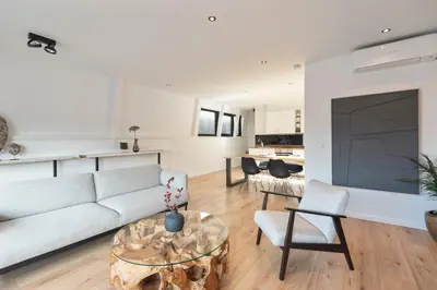 a living room with a couch and a table at Sack-Time fashion boutique hotel 1 & 2 in Zandvoort