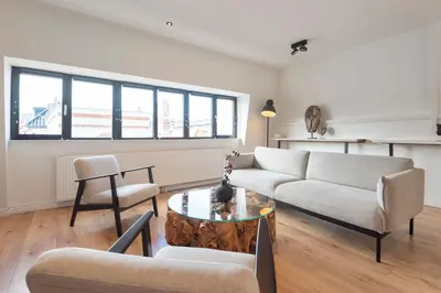 a living room with a couch and a table at Sack-Time fashion boutique hotel 1 & 2 in Zandvoort