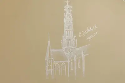 a building with a clock tower in the fog at City Attic Haarlem in Haarlem
