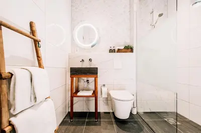 a bathroom with a toilet and a sink at West 7 in Zandvoort