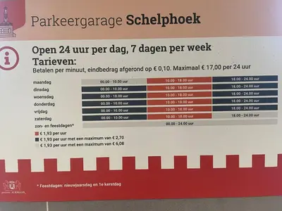 a sign on the wall of a train timetable at Zandstudio in Alkmaar